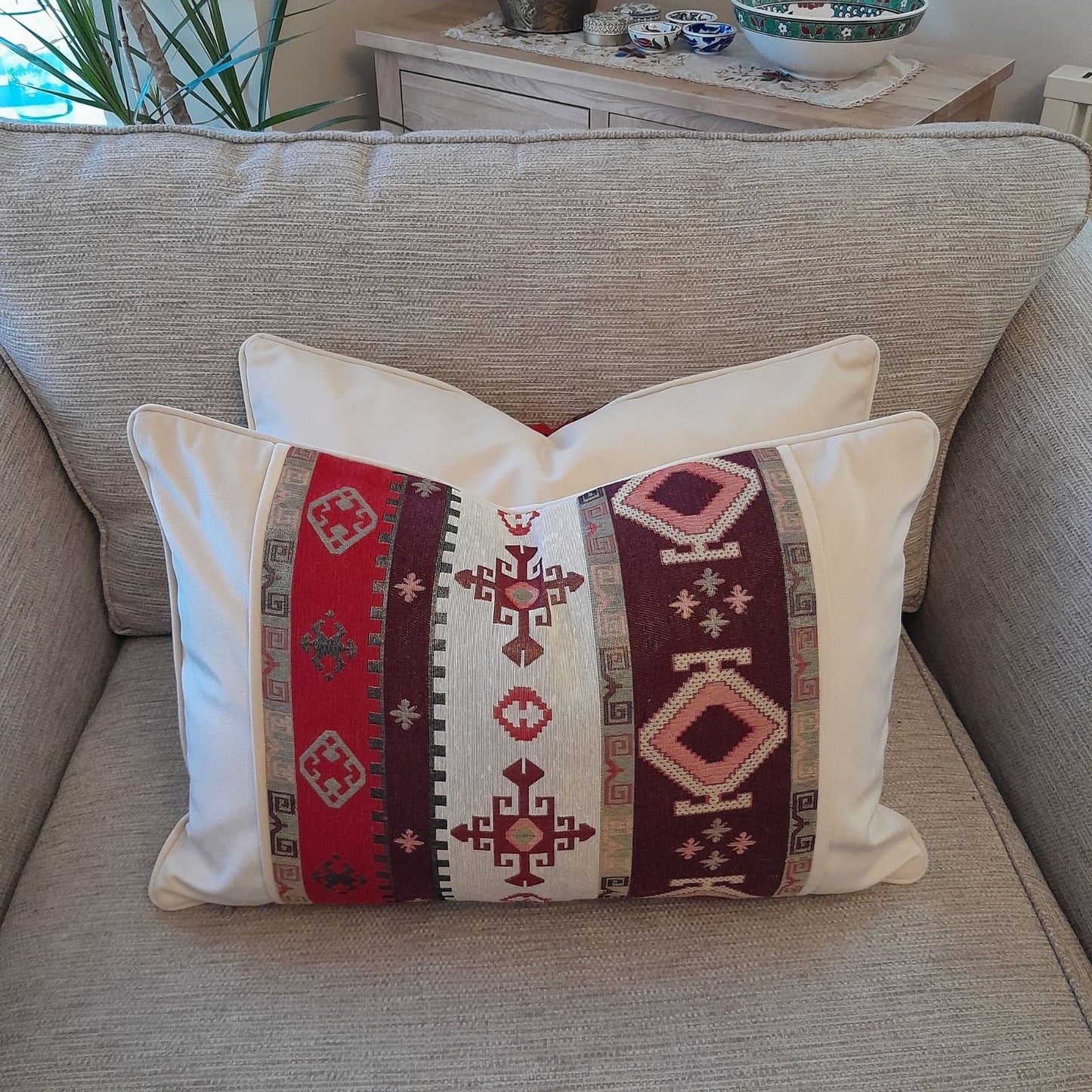 Turkish kilim design cushion cover, red ,brown and cream colour kilim motifs at the front, cream colour on reverse